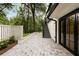 A stone patio has access to the yard and has double doors leading into the home at 1155 Peachtree Battle Nw Ave, Atlanta, GA 30327