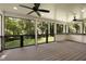 Spacious screened porch with a wood ceiling and views of the backyard at 1155 Peachtree Battle Nw Ave, Atlanta, GA 30327