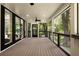 Inviting screened porch with plenty of room and great views of the landscape at 1155 Peachtree Battle Nw Ave, Atlanta, GA 30327