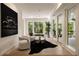 Sitting room with large windows, an art piece, and a decorative rug at 1155 Peachtree Battle Nw Ave, Atlanta, GA 30327