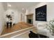 Comfortable sitting room with a fireplace, hardwood floors, and neutral decor at 1155 Peachtree Battle Nw Ave, Atlanta, GA 30327