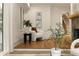 Sitting room featuring hardwood floors, a stone fireplace, and natural light at 1155 Peachtree Battle Nw Ave, Atlanta, GA 30327