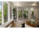 Sunroom with outdoor views, a sliding door, and lots of natural light at 1155 Peachtree Battle Nw Ave, Atlanta, GA 30327