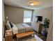 Cozy bedroom with natural light and a TV at 2691 Old South Dr, Jonesboro, GA 30236