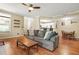 Comfortable living room with hardwood floors, ceiling fan, and view of the kitchen and dining area at 539 Mcgill Park Ne Ave, Atlanta, GA 30312
