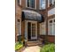 Close-up view of unit entrance shows brick exterior and covered entry at 737 Barnett Ne St # B6, Atlanta, GA 30306