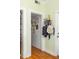 Entry hallway featuring hardwood floors, bright wall decor, and unique coat rack at 737 Barnett Ne St # B6, Atlanta, GA 30306