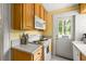 Charming kitchen with white countertops, stainless steel appliances, and wood cabinetry at 737 Barnett Ne St # B6, Atlanta, GA 30306