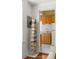 View of shelving with books and a glimpse of the kitchen at 737 Barnett Ne St # B6, Atlanta, GA 30306