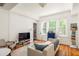 Bright living room features hardwood floors and neutral decor at 737 Barnett Ne St # B6, Atlanta, GA 30306