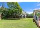 Large backyard with spacious lawn, shed, play set and deck, ideal for Gathering activities and outdoor fun at 11 Chad Ct, Mcdonough, GA 30253