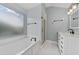 Modern bathroom with glass enclosed shower, soaking tub and double sinks at 11 Chad Ct, Mcdonough, GA 30253