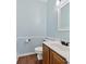 Powder room with hardwood floors, fresh paint, and a new vanity with sink at 11 Chad Ct, Mcdonough, GA 30253
