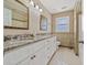 Neutral bathroom with granite counters, double sinks, and tiled floors at 11 Chad Ct, Mcdonough, GA 30253