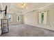 Large bedroom with a tray ceiling, ceiling fan, and large windows at 11 Chad Ct, Mcdonough, GA 30253
