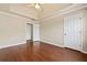 Bedroom featuring wood floors, neutral walls, and a ceiling fan at 11 Chad Ct, Mcdonough, GA 30253