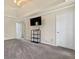 Carpeted bedroom with tray ceilings, and a television on a stand at 11 Chad Ct, Mcdonough, GA 30253