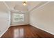 This bedroom has wood floors and a vaulted ceiling with fan at 11 Chad Ct, Mcdonough, GA 30253