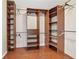 Spacious walk-in closet with custom shelving and hardwood floors at 11 Chad Ct, Mcdonough, GA 30253