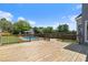 Wide wooden deck overlooking backyard with pool, perfect for outdoor entertaining and summer relaxation at 11 Chad Ct, Mcdonough, GA 30253