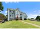 Charming two-story home with a well-manicured lawn and inviting walkway leading to the front door at 11 Chad Ct, Mcdonough, GA 30253