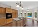 Kitchen island with cooktop and pool view at 11 Chad Ct, Mcdonough, GA 30253