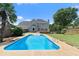 Gorgeous backyard pool with well-maintained yard and deck, perfect for entertaining and outdoor fun at 11 Chad Ct, Mcdonough, GA 30253