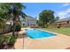 Inviting backyard pool featuring a lounge area and lush landscaping, creating a private outdoor oasis at 11 Chad Ct, Mcdonough, GA 30253