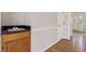Convenient wet bar area with a sink, wood cabinets, and adjacent to a hallway at 11 Chad Ct, Mcdonough, GA 30253