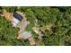 Bird's eye view of the property highlights buildings, and wooded surroundings at 261 Clayton Trl, Canton, GA 30114