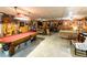 Basement recreational space with pool table, tv, guitars and rustic decor at 261 Clayton Trl, Canton, GA 30114