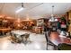 Basement rec room with pool table, dining area, bar and partial kitchen with rustic decor at 261 Clayton Trl, Canton, GA 30114