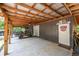 Spacious carport featuring a covered area, concrete floor, and ample space for parking and storage at 261 Clayton Trl, Canton, GA 30114