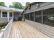 Large wooden deck with screened-in porch, ideal for entertaining at 261 Clayton Trl, Canton, GA 30114