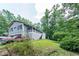 Exterior of a house with gray siding, white lattice and covered front porch at 261 Clayton Trl, Canton, GA 30114