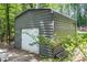 Exterior of gray building with white garage door and siding at 261 Clayton Trl, Canton, GA 30114