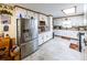 The kitchen includes a stainless steel refrigerator and white cabinets at 261 Clayton Trl, Canton, GA 30114