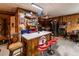 Kitchen with rustic decor, marble bar top, and red bar stools at 261 Clayton Trl, Canton, GA 30114