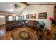 Spacious living room featuring hardwood floors, sectional seating, and vaulted ceilings at 261 Clayton Trl, Canton, GA 30114
