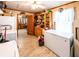 A view of the pantry includes a chest freezer, wooden shelving, and laundry machines at 261 Clayton Trl, Canton, GA 30114