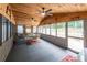Cozy screened porch with wood ceiling, perfect for enjoying the outdoors at 261 Clayton Trl, Canton, GA 30114