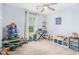 Playful bedroom featuring a selection of toys, a cozy reading nook, and plenty of natural light at 3117 Blowing Wind Nw Ct, Acworth, GA 30101