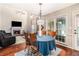 Cozy dining area with a fireplace, large windows, and hardwood floors, perfect for Gathering meals and entertaining guests at 3117 Blowing Wind Nw Ct, Acworth, GA 30101