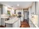 A lovely kitchen featuring a kitchen island, white cabinets, and modern appliances at 3117 Blowing Wind Nw Ct, Acworth, GA 30101