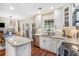 Bright kitchen featuring granite countertops, stainless steel appliances, and a kitchen island with a sink at 3117 Blowing Wind Nw Ct, Acworth, GA 30101