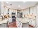 Spacious kitchen with white cabinets, granite countertops, stainless steel appliances, and hardwood floors at 3117 Blowing Wind Nw Ct, Acworth, GA 30101