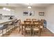 Bright dining room area features a wooden table with six chairs and a view into the kitchen at 405 Brighton Pt, Atlanta, GA 30328