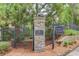 Community entrance sign featuring the community's name and a sign indicating homes are available at 405 Brighton Pt, Atlanta, GA 30328