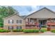 Charming two-story townhouse featuring a mix of stone and siding with inviting balconies and a well-maintained landscape at 405 Brighton Pt, Atlanta, GA 30328