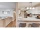 A modern kitchen featuring sleek countertops, stainless steel appliances, and open layout to living area at 405 Brighton Pt, Atlanta, GA 30328
